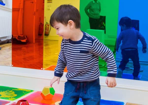Three-year-old Kenji Mathews on the colourful gel floor
