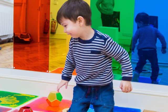 Three-year-old Kenji Mathews on the colourful gel floor