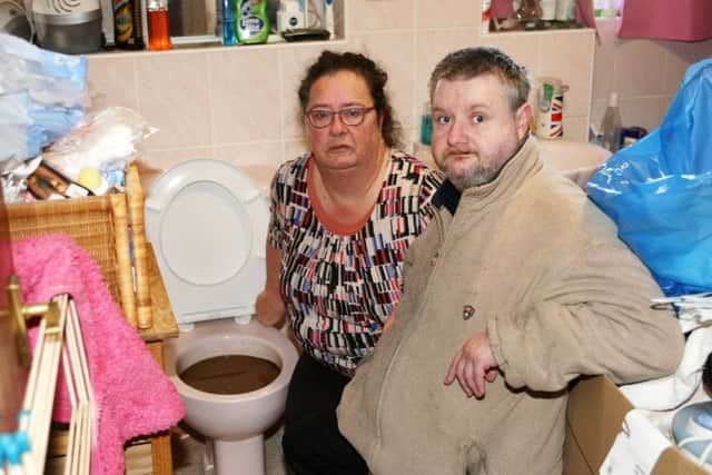 Cheryl Oliver and Graham Phillips were not happy about the blocked loo. Photo by Derek Martin Photography.
