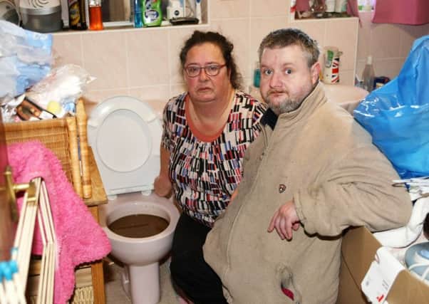 Cheryl Oliver and Graham Phillips were not happy about the blocked loo. Photo by Derek Martin Photography.