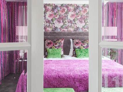 One of the colourful bedrooms at The Absalon.