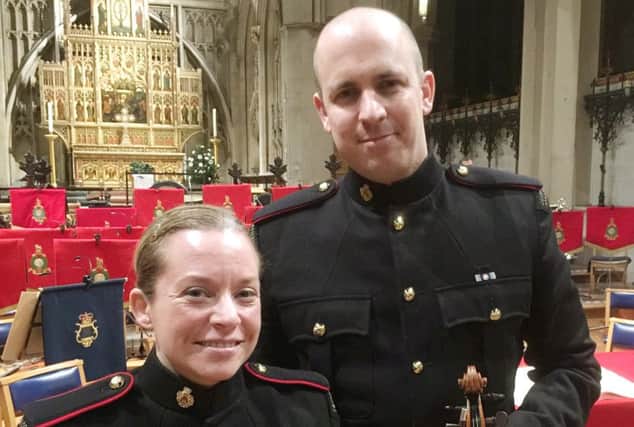 Musician Katie Davis and Corporal James Sandalls, violinists with the Countess of Wessex String Orchestra and the Royal Marines