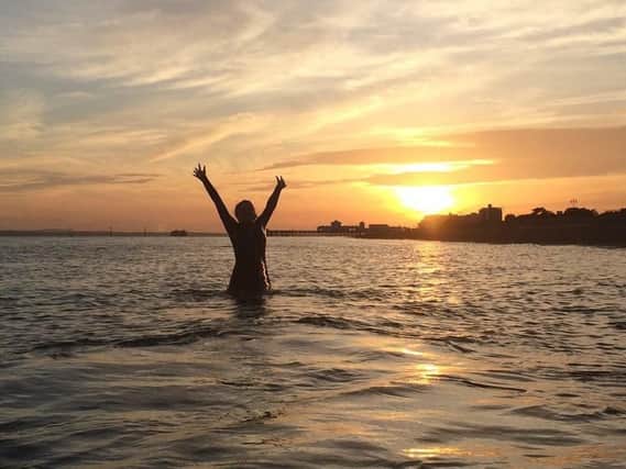 A member of the Portsmouth Triathletes enjoys a dip at Eastney. You can join for next to nothing - another brilliant, low-cost activity in Portsmouth          Credit: Elliot Webber