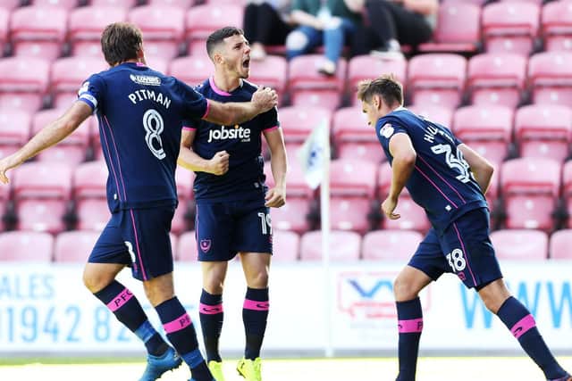 Conor Chaplin celebrates his equaliser against Wigan earlier this season