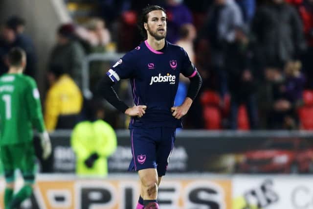 A dejected Christian Burgess after Rotherham's late winner against Pompey. Picture: Joe Pepler