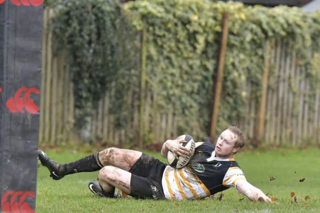 Luke Simmons slides in for the opening try. Picture: Neil Marshall (171730-1)