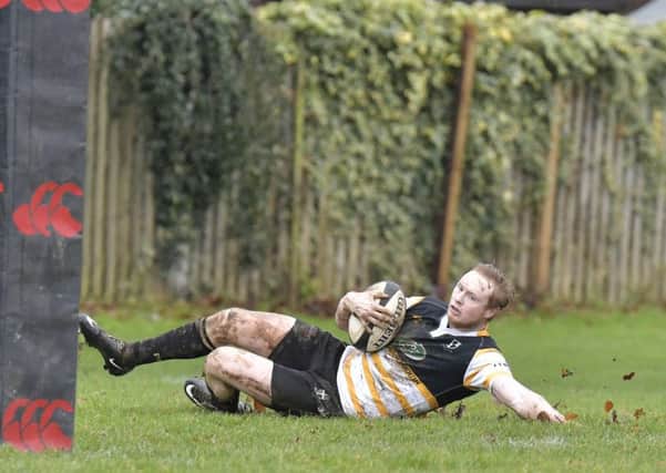 Luke Simmons slides in for the opening try. Picture: Neil Marshall (171730-1)