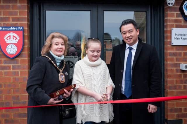 Olivia Carter cuts the ribbon to officially open the community hub with Mayor of Havant Cllr Mrs Elaine Shimbart and Alan Mak MP. Olivia from Front Lawn Academy Primary won a competition to be the official ribbon cutter
Picture: Vernon Nash (180053-004)