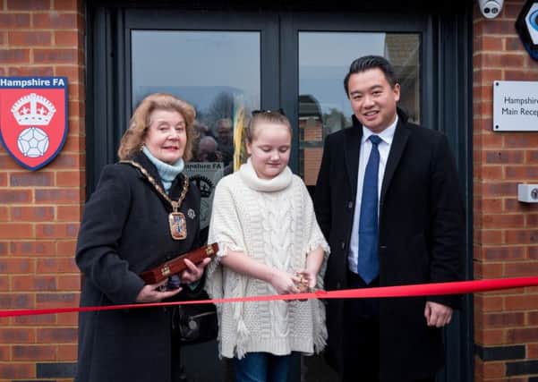 Olivia Carter cuts the ribbon to officially open the community hub with Mayor of Havant Cllr Mrs Elaine Shimbart and Alan Mak MP. Olivia from Front Lawn Academy Primary won a competition to be the official ribbon cutter
Picture: Vernon Nash (180053-004)