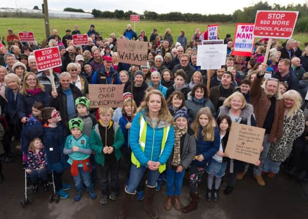 Members of a group which started on Facebook called Save Warsash are pictured protesting against Fareham Borough Council's plans to build 800 homes in the area. Protest organiser Rachel Follett is centre front