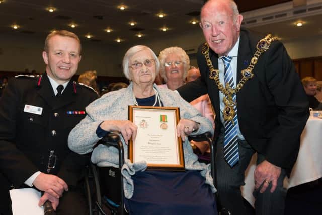 From the left are Chief Fire Officer Neil Odin, Margaret Aldridge, Yvonne Ferguson, daughter of Margaret, and Lord Mayor of Portsmouth Councillor Ken Ellcome Picture: Duncan Shepherd (180086_010)