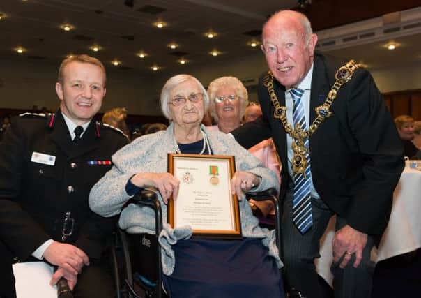 From the left are Chief Fire Officer Neil Odin, Margaret Aldridge, Yvonne Ferguson, daughter of Margaret, and Lord Mayor of Portsmouth Councillor Ken Ellcome Picture: Duncan Shepherd (180086_010)