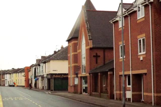NOW: The site of the church today complete with modern building.