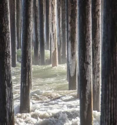 Under the Pier at Pismo Beach, California by Mike Inglis