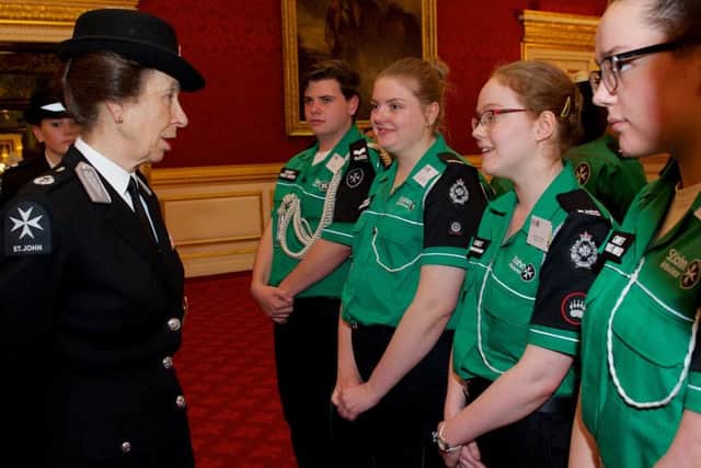The Princess Royal talks to Samantha Cooper, third left, at a reception at St James' Palace