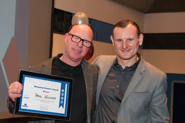 Paul Deluchy collects his Managing Directors Award