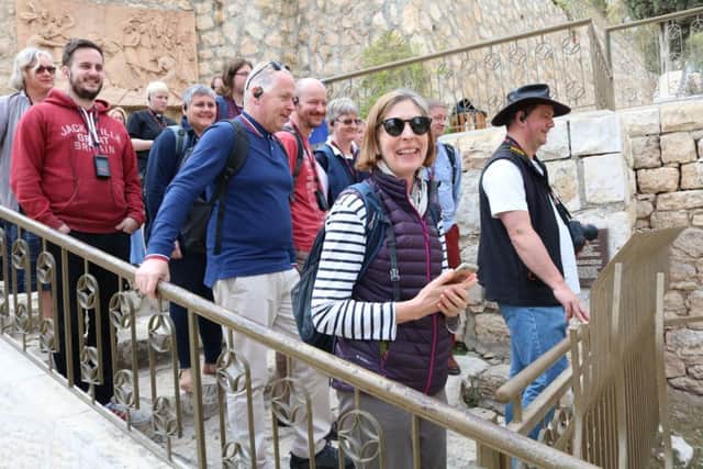 The curates stand on the ancient steps outside the High Priests house in Jerusalem, where Jesus would have walked