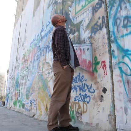 Gosport curate the Rev Chris Richardson examines the security wall between Israel and Palestine