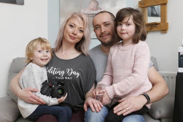 Photographer Lauren Bennett-Tippens has picked up an international award for best software for her company Lemon Sky Actions. Here she is with her husband  James Tippins and their childen Noah, four, and Taylor, six     Picture: Habibur Rahman   (180154-377)
