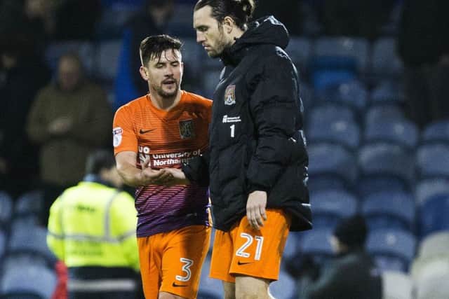 John-Joe OToole, right, is consoled by team-mate David Buchanan at the final whistle at Fratton Park  Picture: Kirsty Edmonds