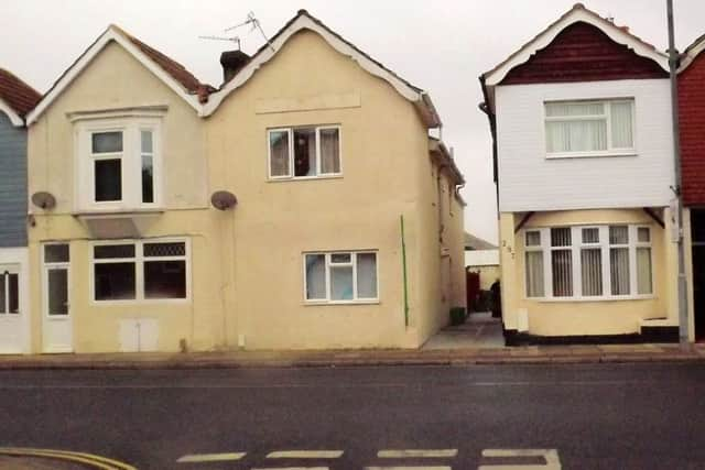 NOW: The same location today with the shops turned into houses and modern windows and doors added.