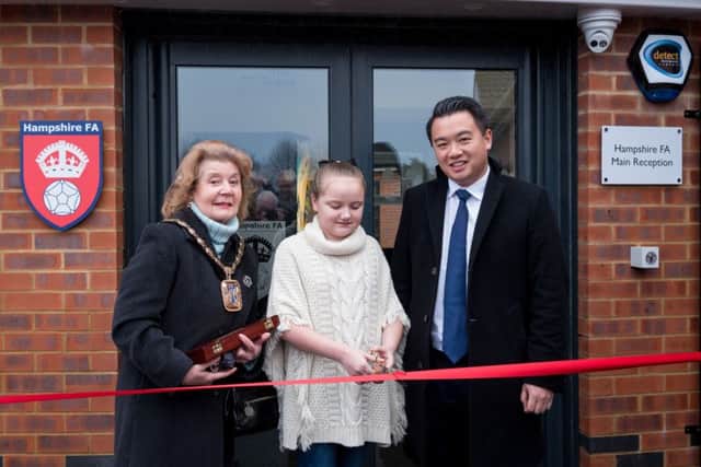 Olivia Carter cuts the ribbon to officially open the Leigh Park Community Sports Hub with Mayor of Havant Cllr Mrs Elaine Shimbart and Alan Mak MP Picture: Vernon Nash