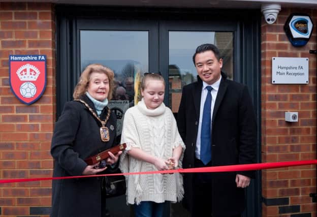 Olivia Carter cuts the ribbon to officially open the Leigh Park Community Sports Hub  with Mayor of Havant Cllr Mrs Elaine Shimbart and Alan Mak MP      Picture: Vernon Nash