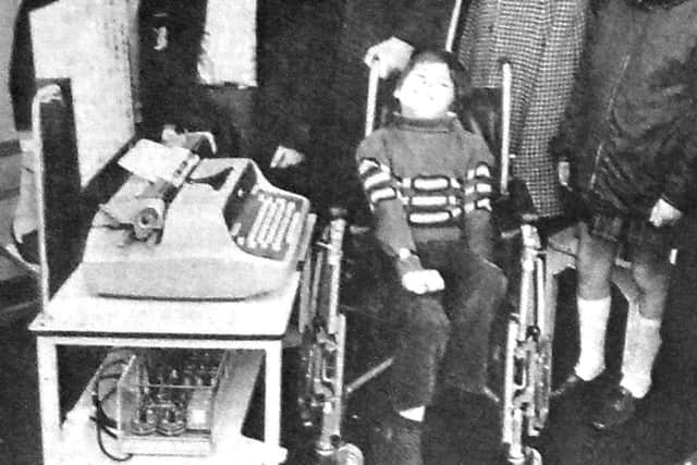 Members of the Chipper Club who went to the Cerebral Palsy Day Unit at Queen Alexandra Hospital, Cosham, to see the handing over of the Possum elctric typewriter they had helped raise money for, pictured with Unlce Mike and 10-year-old Lee Webber who demonstrated how he uses the machine to write with his feet