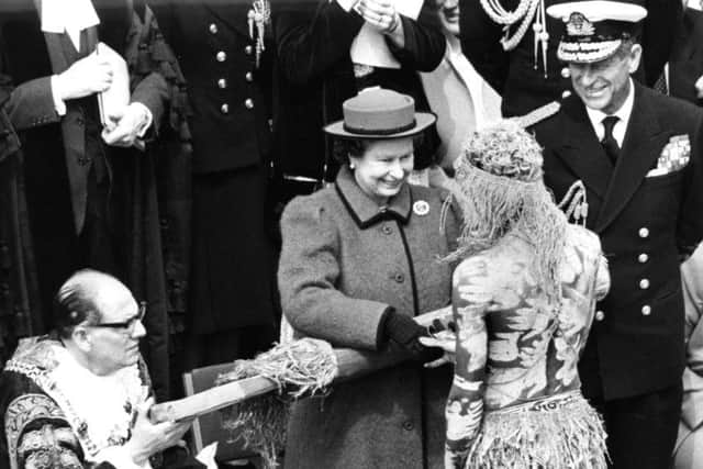 The Queen greets one of the Bararroga Mimi aboriginal dancers in Guildhall Square, Portsmouth, in 1987 PP5475 PPP-160406-152448001