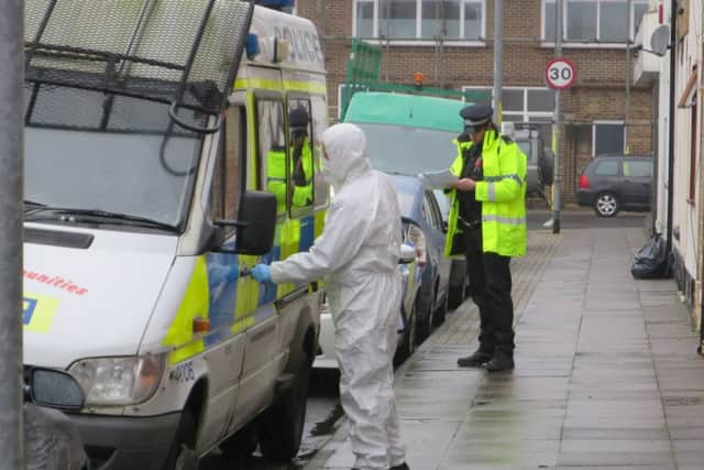 Police officers in Toronto Road after the attack