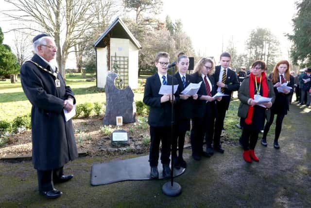 Students from The Cowplain School reading Holocaust memorial poems