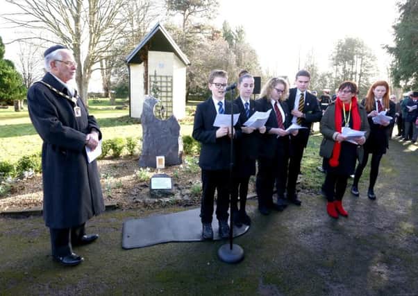 Students from The Cowplain School reading Holocaust memorial poems