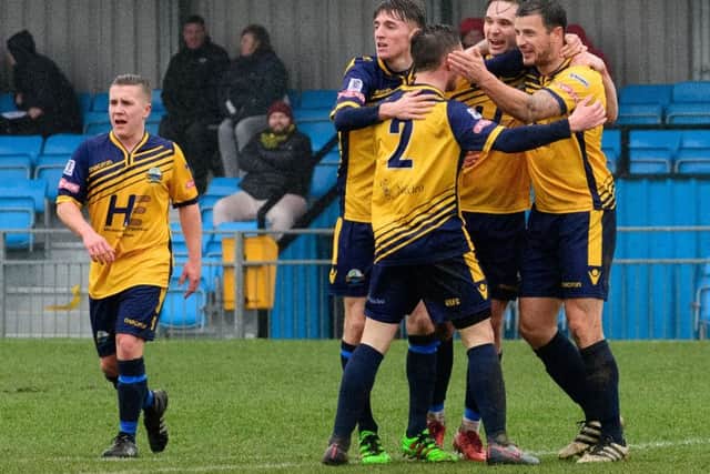 Gosport players celebrate their first goal against Dorchester scored by Craig McAllister. Picture: Keith Woodland