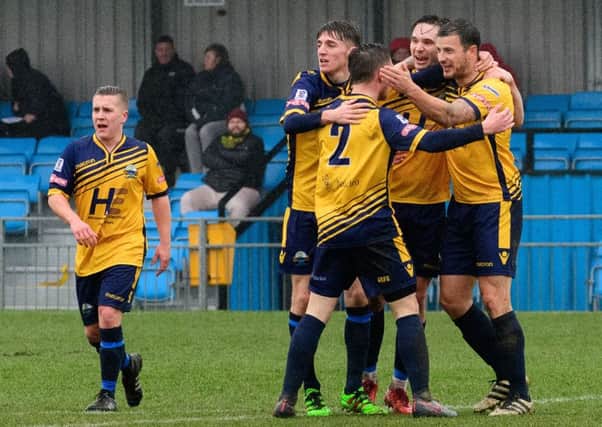 Gosport players celebrate their first goal against Dorchester scored by Craig McAllister. Picture: Keith Woodland