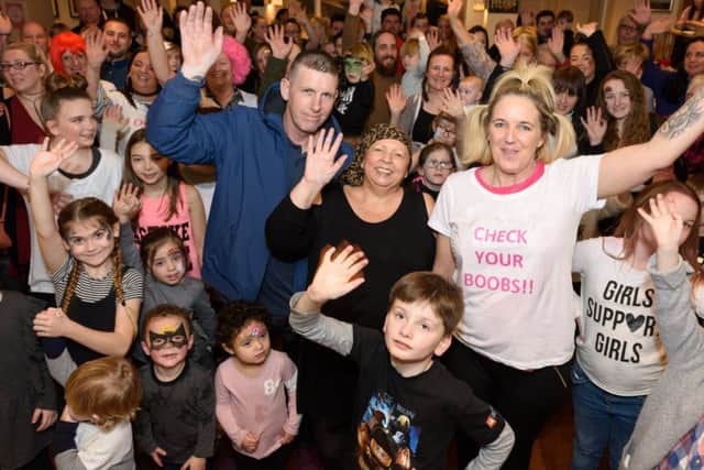 Jo,. centre, with her partner Shane Anthony, left, and her friend and event organiser Leanna Stratford surrounded by friends, family and supporters
Picture: Duncan Shepherd (180089_011)