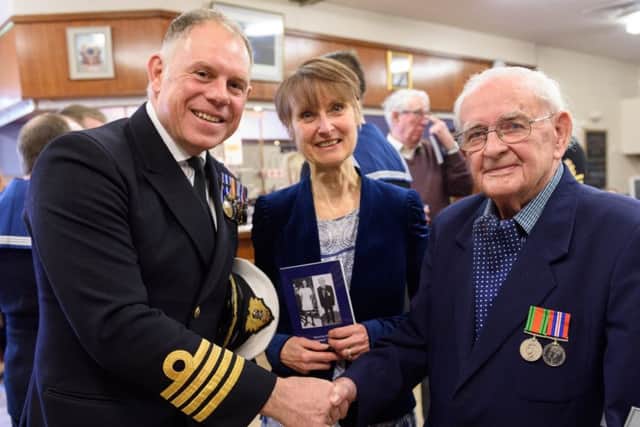 Denis Cole with Captain Bill Oliphant and Denis's daughter Christine Mustchin. Picture by Duncan Shepherd