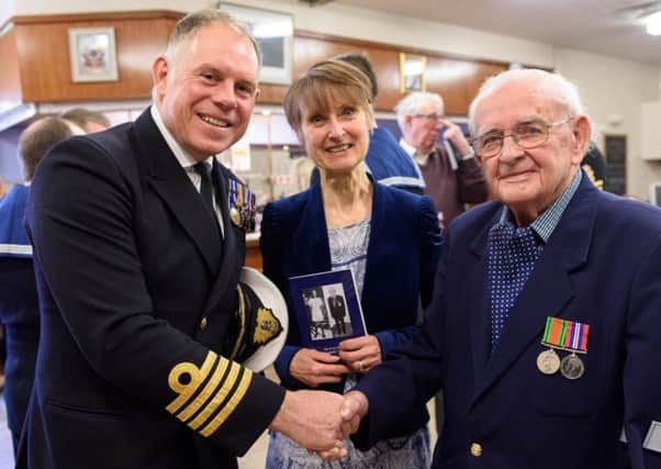 Denis Cole with Captain Bill Oliphant and Denis's daughter Christine Mustchin. Picture by Duncan Shepherd