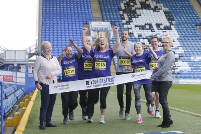 Christian Burgess and the Pompey in the Community Team, with Cllr Linda Symes and Jayne Fearn from Simplyhealth holding the finish linePicture: Habibur Rahman