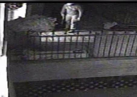 CCTV footage of the burglar getting ready to enter a house with a sawn-off-shotgun