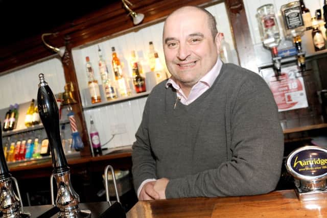 Steve Hudson behind the bar