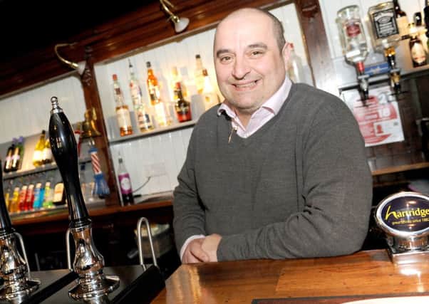 Steve Hudson behind the bar