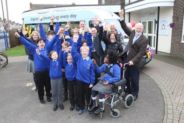 Cliffdale Primary Academy pupils with sponsors St James Place, staff of Cliffdale and staff of Variety in front of the new bus Picture: Habibur Rahman (180164-6)