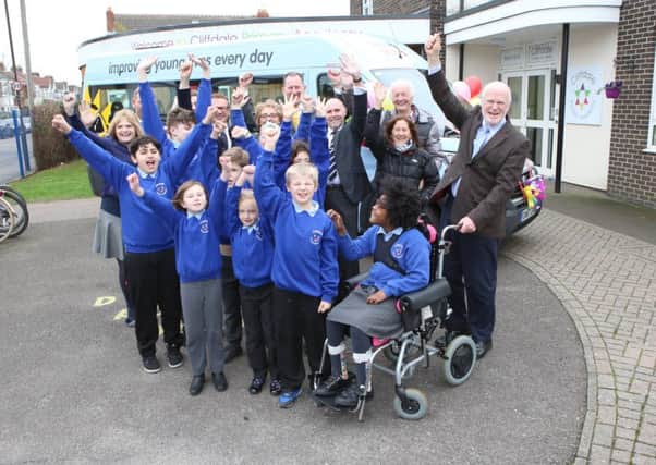 Cliffdale Primary Academy pupils with sponsors St James Place, staff of Cliffdale and staff of Variety in front of the new bus 


Picture: Habibur Rahman (180164-6)
