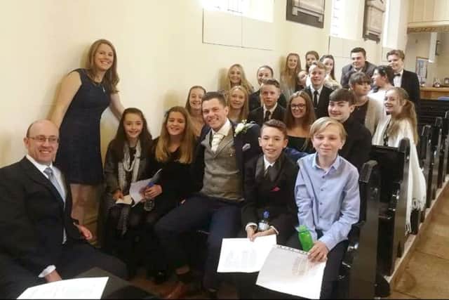 Pupils from Fareham Musical Society Youth Theatre with, far left, musical director Louise Helyer and Stuart Frank in the middle Picture: The Franks