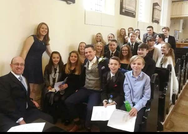 Pupils from Fareham Musical Society Youth Theatre with, far left, musical director Louise Helyer and Stuart Frank in the middle Picture: The Franks