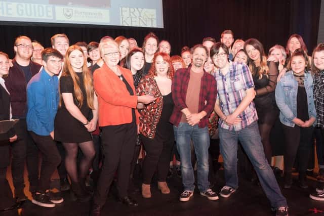 Urban Vocal Group co-founders Charlie Fletcher and Amba Tremain (centre) and other members with Cllr Linda Symes and Chris Broom, entertainments editor of The News Picture: Keith Woodland