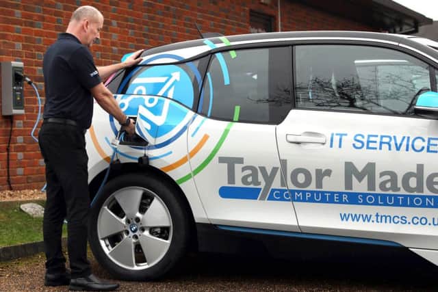 One of Taylor Made's electric cars is charged up