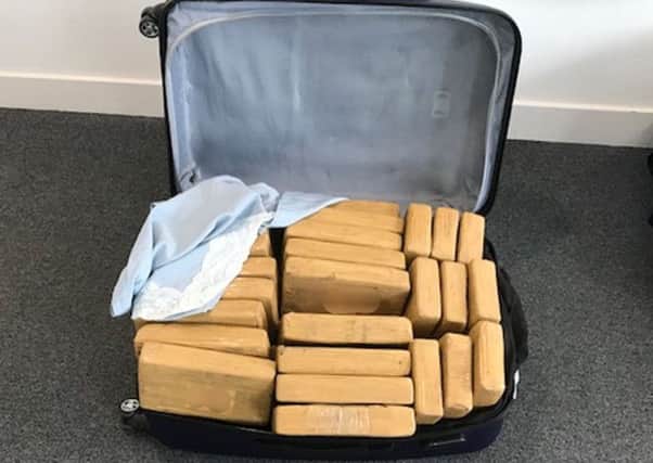 A suitcase containing packages of cocaine. Picture: Border Force/PA Wire