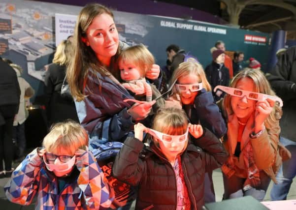Catherine Riddett, Rupert 1, Alasdair 4, Iris 5, Lilly 9 and Amanda Gregory using special glasses to observe glowing gas at an evening of astronomy, stargazing, space activities, cosmology chat and talks. 
Picture: Habibur Rahman