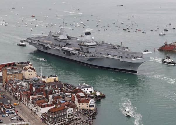 HMS Queen Elizabeth's departure from Portsmouth has been delayed because of sprinkler problems. Picture: LPhot Kyle Heller